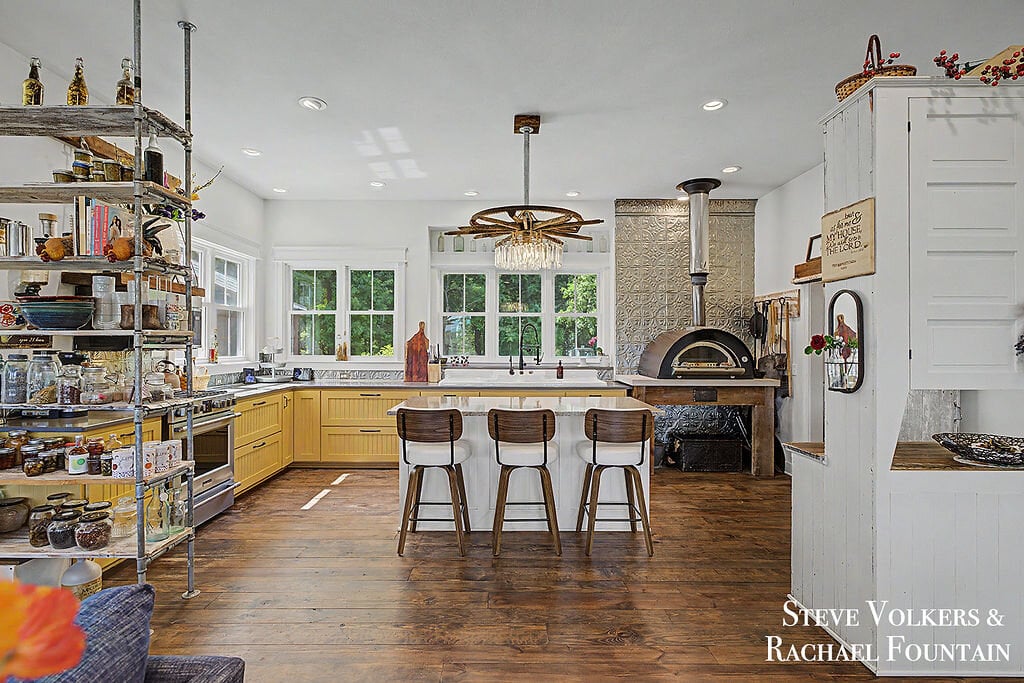 The open great room — kitchen, dining, and living together